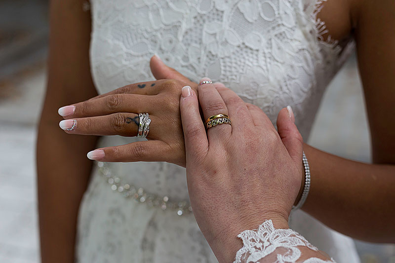 Close-up of wedding rings and lace dress details during a relaxed Wolverhampton wedding by South Wales based Hannah Clegg Photography