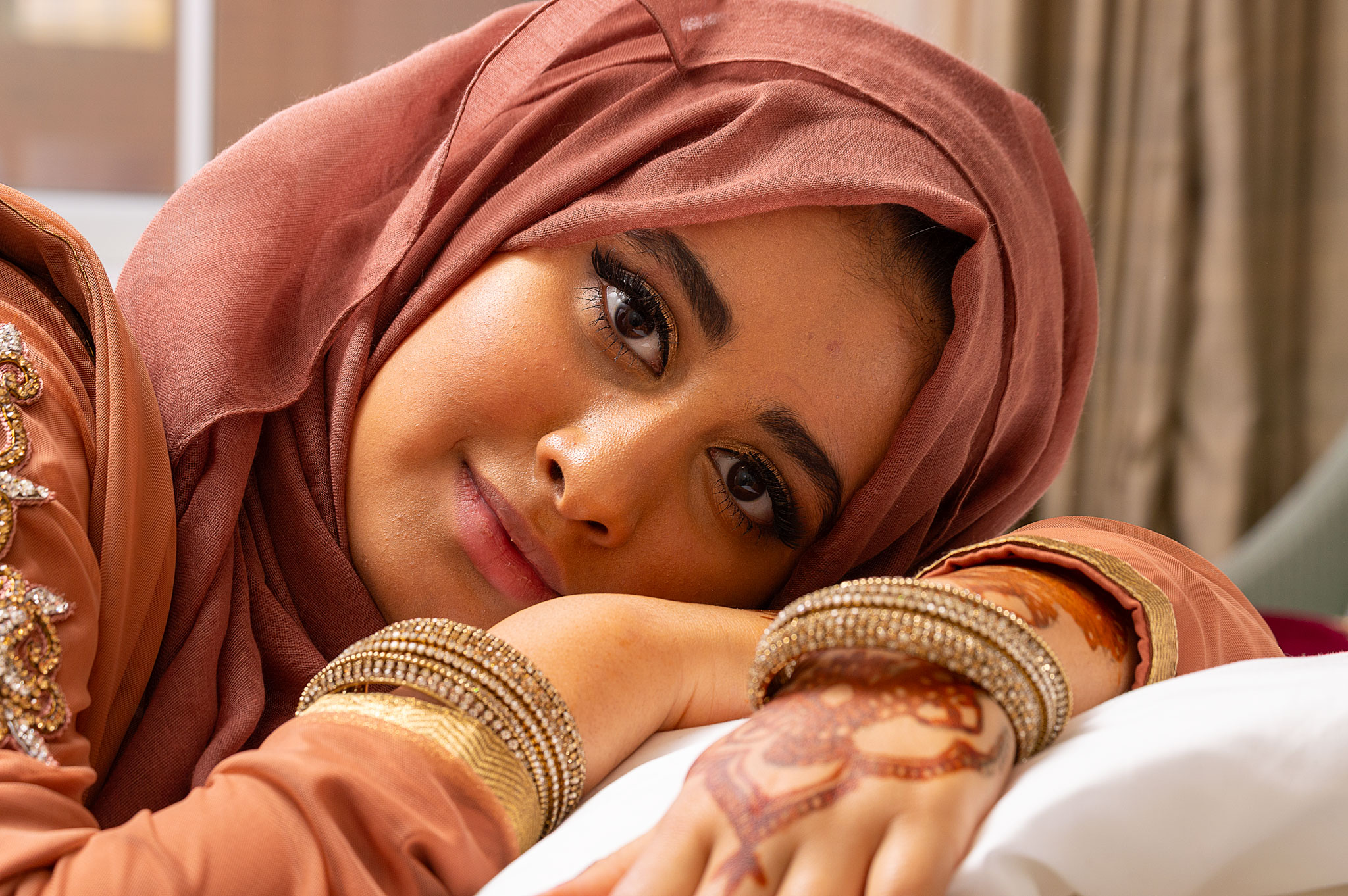 A beautiful, candid close-up portrait highlighting natural details and genuine emotion in an unposed, relaxed setting