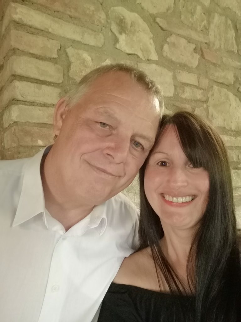 Tracy and Charlie, South Wales wedding photographers, smiling together.